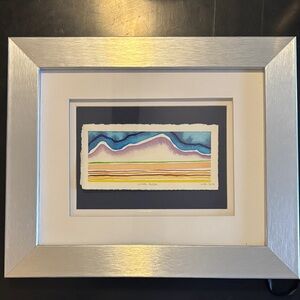 Silver Framed Abstract Art with Blue and Yellow Accents